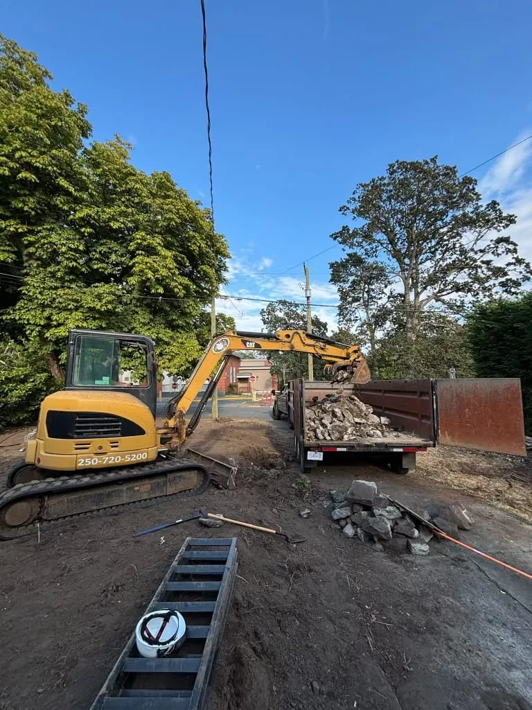 Breaking out the concrete and loading it off for recycling.
